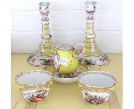 A group of 19th century Dresden yellow ground porcelain, comprising; a pair of candlesticks, crossed swords to base, (one wit