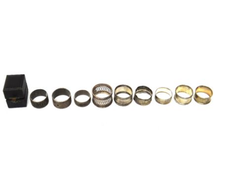 Six silver napkin rings, a Sterling napkin ring, combined weight 206 gms, a foreign napkin ring, a plated napkin ring and a n