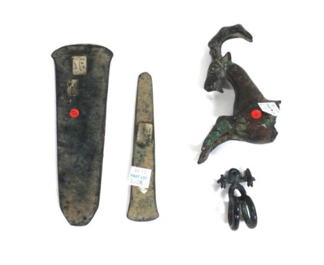 A group of Luristan bronzes, including a stag finial;  a pommel from a dagger; a  ring ; ten axe heads, and two  small figure