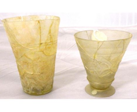 Two clear glass cups, Iran, 9th-10th century, the first a beaker on a plain base, the wheel-cut decoration arranged with a la