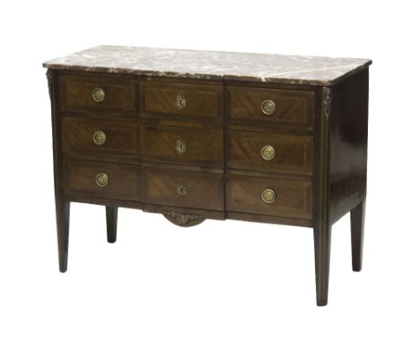 A 19th century French gilt metal mounted marble top commode of Louis XVI style, with three breakfront drawers on tapering sup