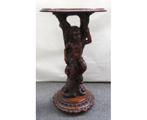 A 20th century console, the semi elliptic top on a Rococo Revival figural carved base, 52cm wide.