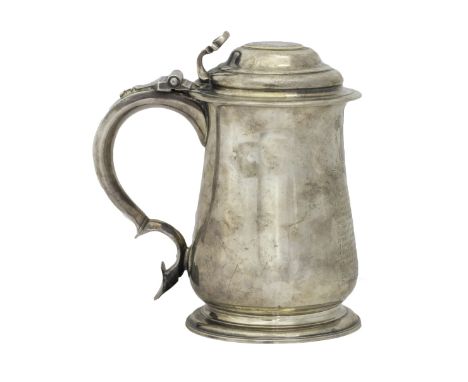 A George II silver hinge lidded tankard, of baluster form, the cover mounted with a medallion, detailed with the portrait of 