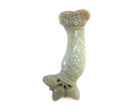 A Moghul celadon jade dagger hilt, 19th century, carved with poppies and a three lobed pommel,the stone shading from a greysi