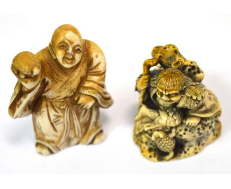 A Japanese Meiji period carved ivory netsuke modelled as a seated gentleman holding a staff before a three-legged toad, signe