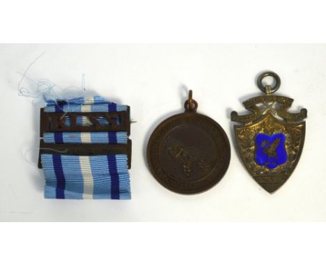 An Edwardian hallmarked silver and enamelled medallion inscribed 'Liverpool & Dist. Gymnasia League 1908-1909' centred with a
