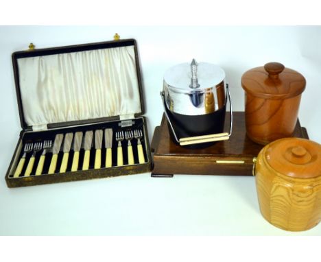 A small collectors' lot to include a cased set of plated fish knives and forks, two vintage wooden ice buckets and a metal an