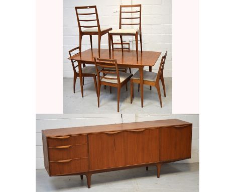 A retro c1960s McIntosh dining suite comprising a rectangular extending table, length when extended 188cm, six ladder back di