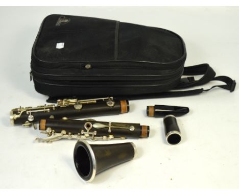 A cased English made TJJ CL-10S clarinet.