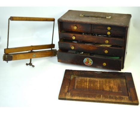 A vintage toolbox containing a quantity of tools and a Watt's kit bag stretcher (2).