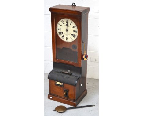 An early 20th century mahogany cased National Time Recorder with circular dial set with Roman numerals, inscribed 'Time Recor