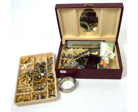 A quantity of costume jewellery to include necklaces, earrings, a hallmarked silver bangle, silver bracelets etc.