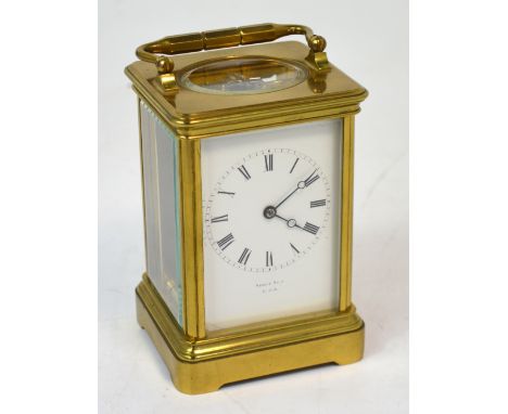 Drocourt of Paris; a mid 19th century brass eight day carriage clock, the enamel dial set with Roman numerals and inscribed '