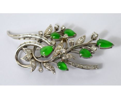 A platinum, diamond and jade floral spray brooch, the frame set with both brilliant cut and baguette cut diamonds and six pea