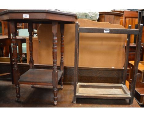 A mahogany occasional table with octagonal top above ringturned supports and castors, an oak stick/umbrella stand and a Victo