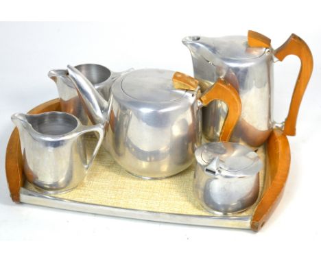 A Picquot ware tea service to include a melamine, metal and wood tray, a teapot, milk jug, sugar bowl, creamer and coffee pot