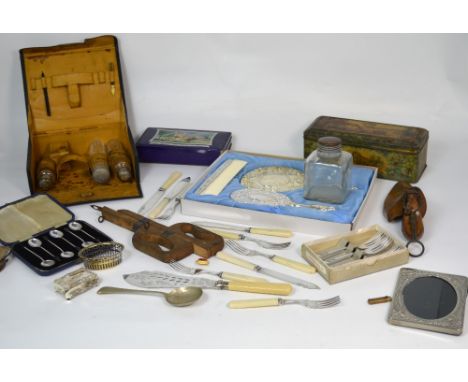 A collectors' lot comprising silver plated items to include flatware, knife rests, vanity sets, shoe stretchers, vintage rule
