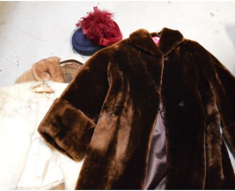A vintage ladies' beaver lamb fur coat, a lambswool coat with mink collar, a white fur jacket, a faux fur wrap and two hats (