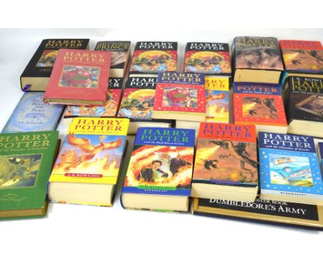 Twenty Harry Potter first editions, two 'Harry Potter and the Philosopher's Stone', one hardcover in original cellophane, two