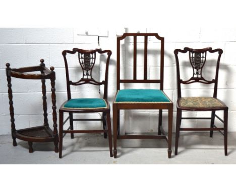 A pair of Edwardian mahogany bedroom chairs with carved central panel on tapering legs, an Edwardian mahogany dining chair on