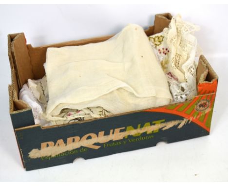 A small quantity of textiles to include a hand embroidered cloth with lace trim, a linen cloth with lace insert, an early 20t