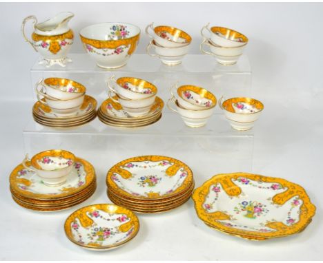 A late 19th century English tea service, each piece decorated with floral sprays on a muted orange ground, pattern no.9526. C