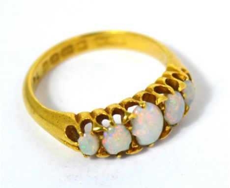 An 18ct yellow gold five stone graduated opal ring, size K, approx 3.9g.