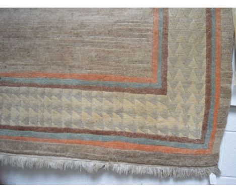 A Tibetan carpet with cotton warp and weft and hand spun woollen pile, approx 302 x 201cm.