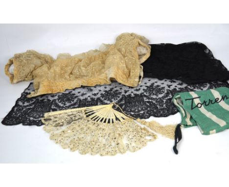 A 19th century embroidered lace shoulder throw (af), a vintage boxed lace fan with sequin decoration and bone sticks and a fu