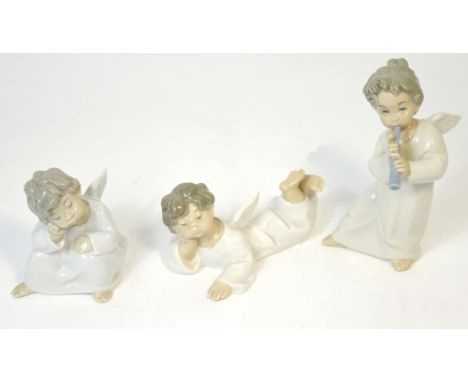 Three Lladró figures of small cherubs, one sleeping with hand on knee, one playing a trumpet and one reclining (3).