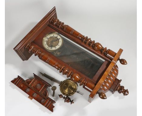 Walnut cased wall clock, the foliate decorated pediment with turned finial, the ivorine dial with Roman numerals, 99cm high