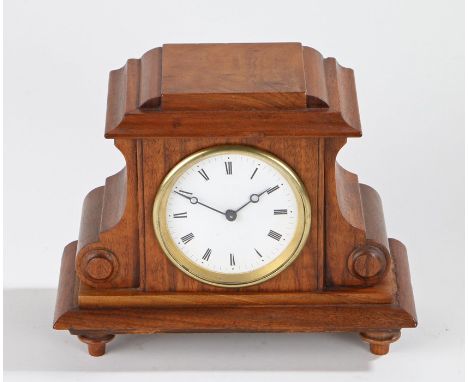 Mahogany cased mantel clock, the white enamel dial with Roman numerals, housed in a later mahogany case with carved roundel d