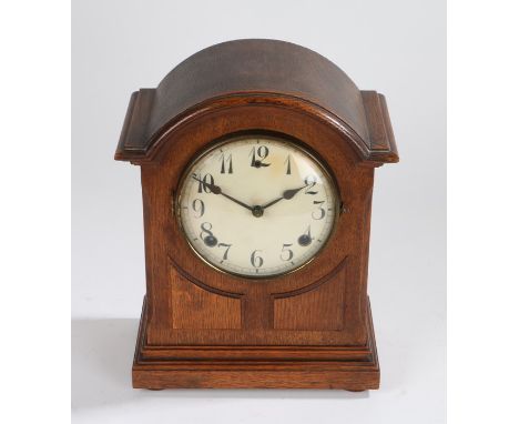 Oak arched case mantel clock, the white dial with Arabic numerals, 23.5cm wide, 30cm high