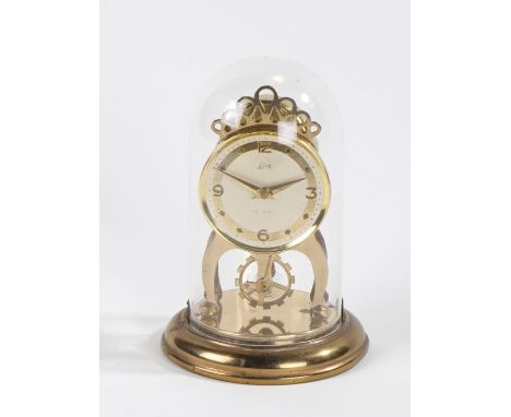 Schatz eight day mantel clock the brass effect dial with Arabic and diamond shaped markers, housed under a dome, 15cm high