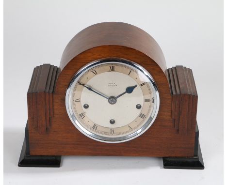 Art Deco mahogany mantel clock, Maple, London, the circular glass face enclosing a signed silvered dial with roman numerals, 