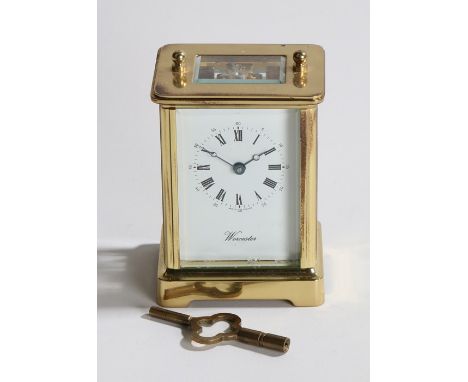 Worcester brass carriage clock, the signed white dial with Roman numerals and outer Arabic minutes track,, 14.5cm to top of h