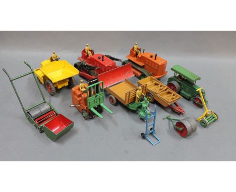 A group of Dinky die cast model agricultural and constructional vehicles to include a Blaw Knox bull dozer, a Heavy Tractor a
