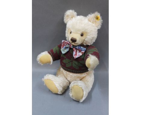 A Steiff Original mask teddy bear, having beige mohair body, with metal button and yellow label to the ear