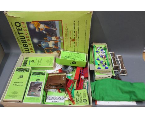 A Subbuteo table soccer game, comprising playing pitch, fence surrounds, 3 boxed sets of 00 scale players of Everton, Tottenh