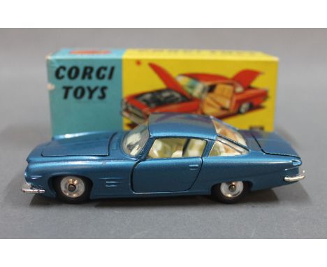 A Corgi Ghia L.6.4 with Chrysler engine (241), having metallic blue body, in a blue and yellow picture box