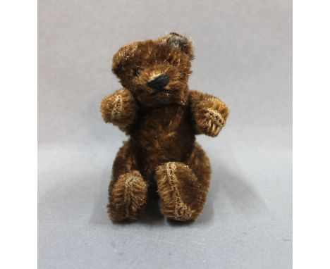 A 1950's/60's Steiff Original teddy, in the rarer dark brown, with no button. Measuring 10cm high 
