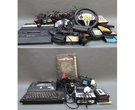 A vintage Atari 2600 games console, accessories, a Sinclair ZX Spectrum keyboard, joystick, a Sega Master system power base a