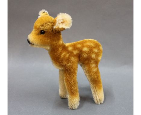 A 1950's Steiff fawn, having plush body and no button, measuring 12cm high 