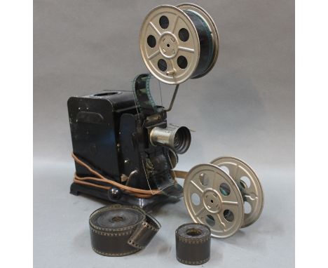 An early 20th century foreign made film projector with reels   