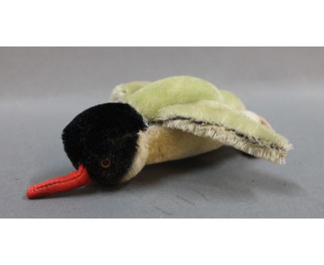 A Steiff "Peggy" penguin, with raised script button, measuring 10cm high  