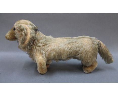 A 1950's Steiff 'Waldi' mohair / plush dachshund dog, having no button. Measuring 34cm long