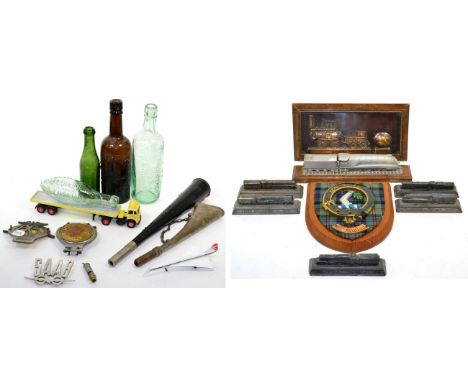 A quantity of collectors items including; five locomotive Britain's paperweights, a small model depicting The Mallard, a wood