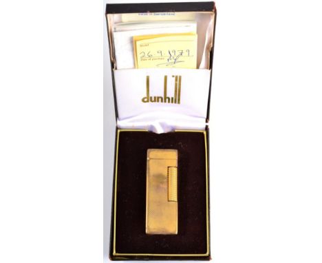 A Dunhill Rollagas Barley pattern engine turned gold plated lighter in original box with paperwork