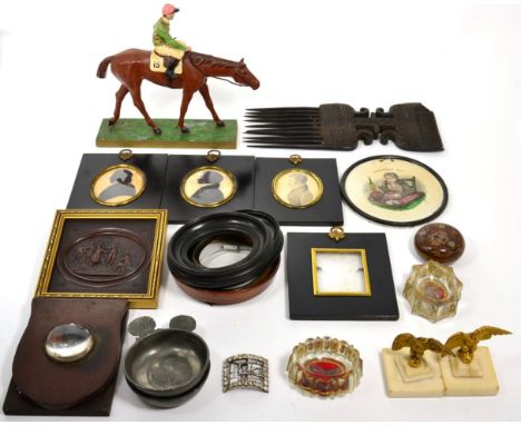 A quantity of collectors items consisting of three silhouettes, four miniature picture frames, pair of gilt metal eagle desk 