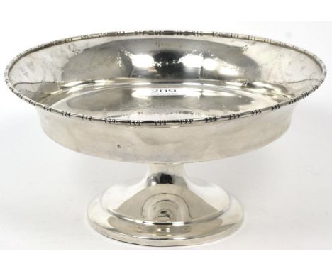 A George V silver pedestal dish, William Aitkin, Birmingham 1913, engraved with ribbon tied swags in the Neo-Classical taste,